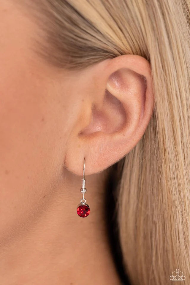 Paparazzi Accessories Corner Kick - Red Dangling from a silver hoop attached to silver popcorn chains, three soccer-inspired charms, including a silver soccer ball, black-painted cleat, and red rhinestone-encrusted heart, swing for a sporty finish. Featur