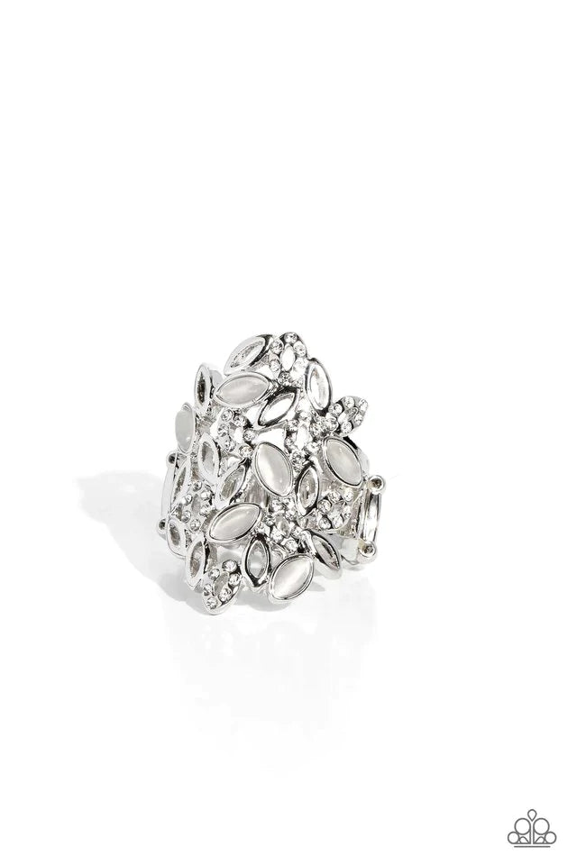 Paparazzi Accessories LEAF Home - White A gorgeous cascade of silver, white rhinestone-encrusted, and white cat's eye marquise-cut frames fan out across the finger, coalescing into an airy, whimsical statement. Features a stretchy band for a flexible fit.