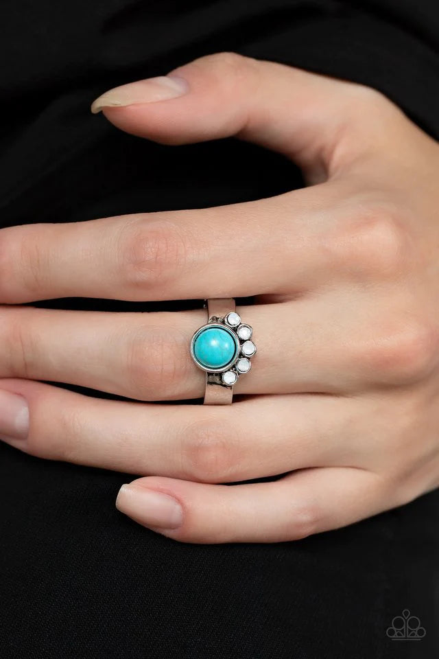 Paparazzi Accessories Havasu Haven - Blue Daintily crowned in a curved row of opaque white rhinestones, a round turquoise stone is pressed into the center of a dainty silver band, resulting in an enchantingly earthy centerpiece atop the finger. Features a