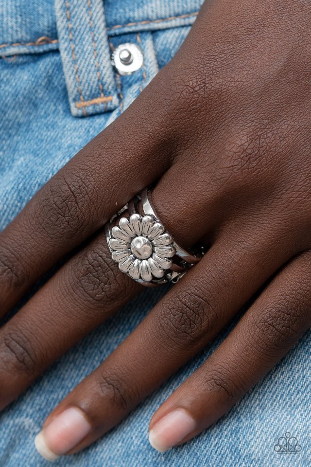 Paparazzi Accessories Roadside Daisies - Silver Brushed in an antiqued shimmer, a rustic silver daisy blooms atop layered silver bands for a whimsical fashion. Features a stretchy band for a flexible fit. Jewelry