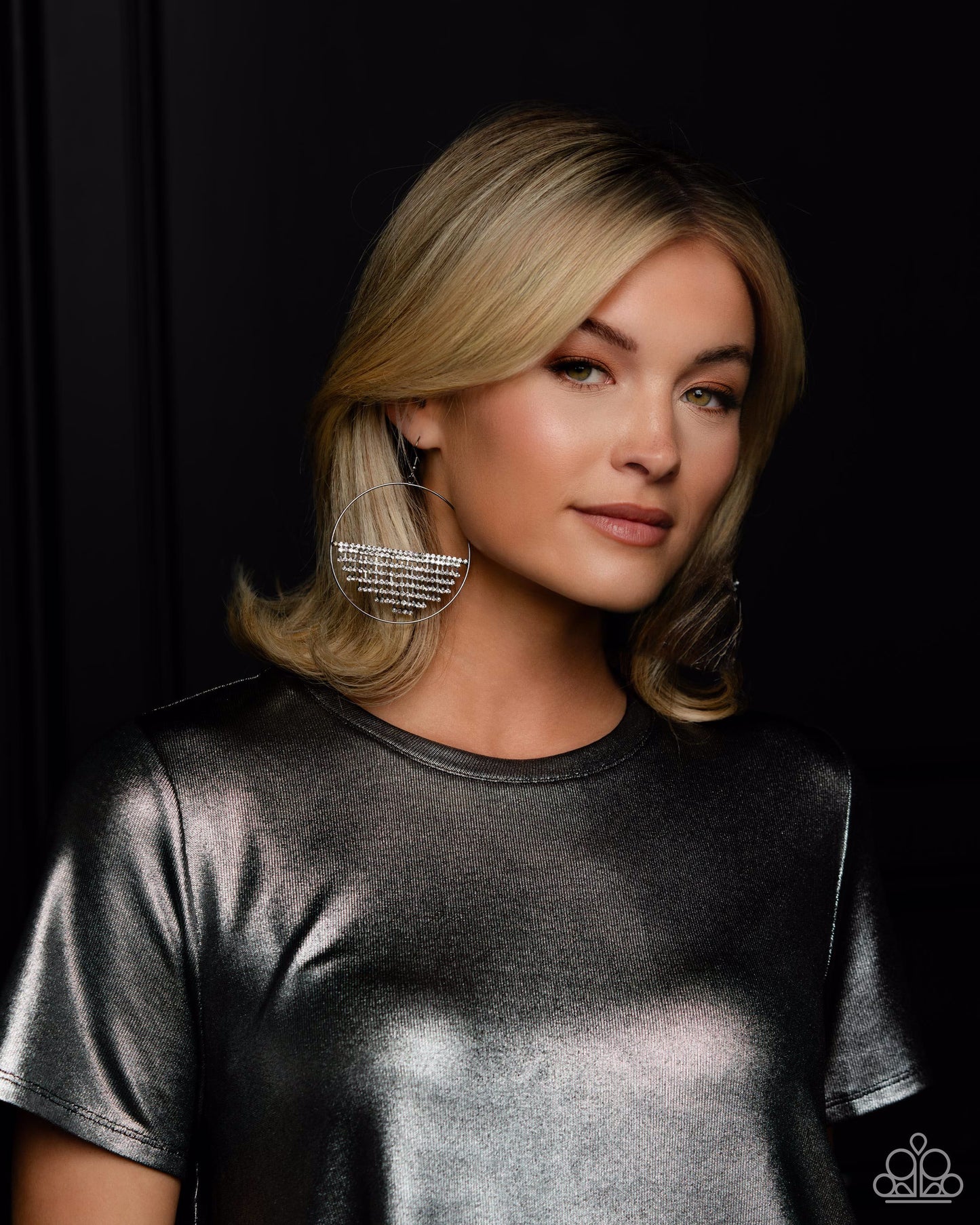 Paparazzi Accessories Fierce Fringe - Black A curtain of white rhinestones is stretched between the edges of a skinny, oversized gunmetal hoop, creating a shimmering display. The rhinestones taper towards the center as they sway and cascade, adding sparkl