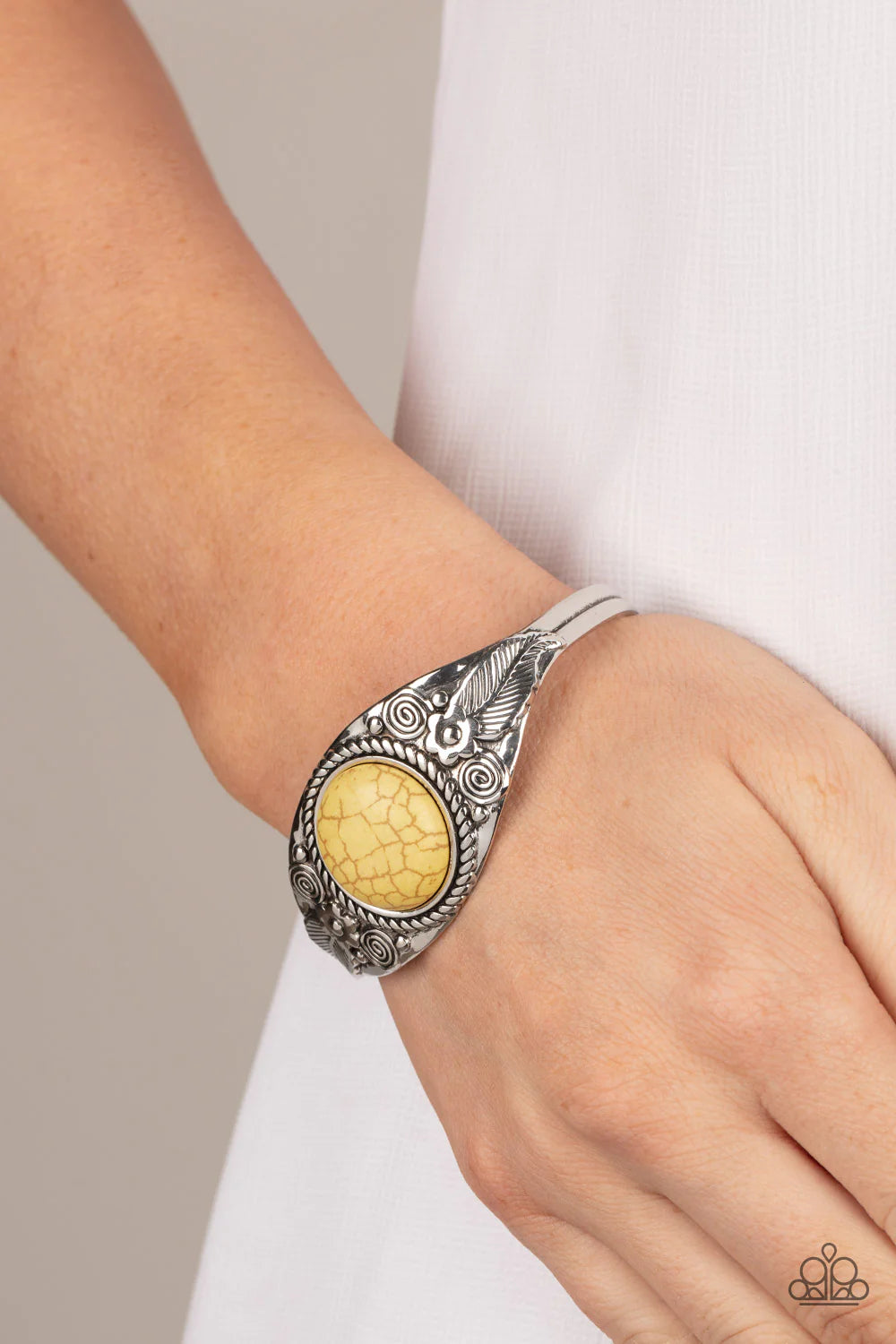 Paparazzi Accessories Whimsically Winslow - Yellow An oversized yellow stone is pressed into the center of a dainty silver cuff abloom with leafy floral accents, creating an earthy centerpiece around the wrist. Sold as one individual bracelet. Jewelry