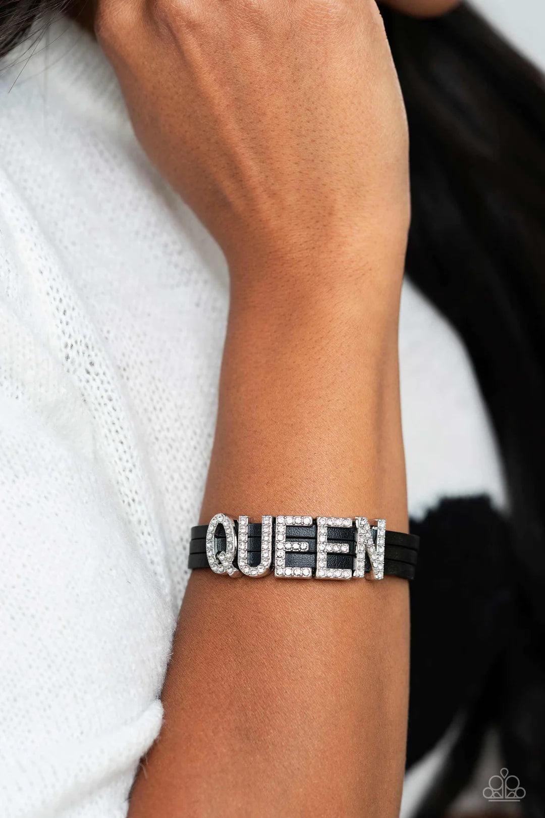 Paparazzi Accessories Queen of My Life - Black Three rows of black leather bands layer around the wrist. Dazzling rhinestones glisten atop the word "QUEEN" gracing the leather bands. Features a magnetic closure. Sold as one individual bracelet. Jewelry