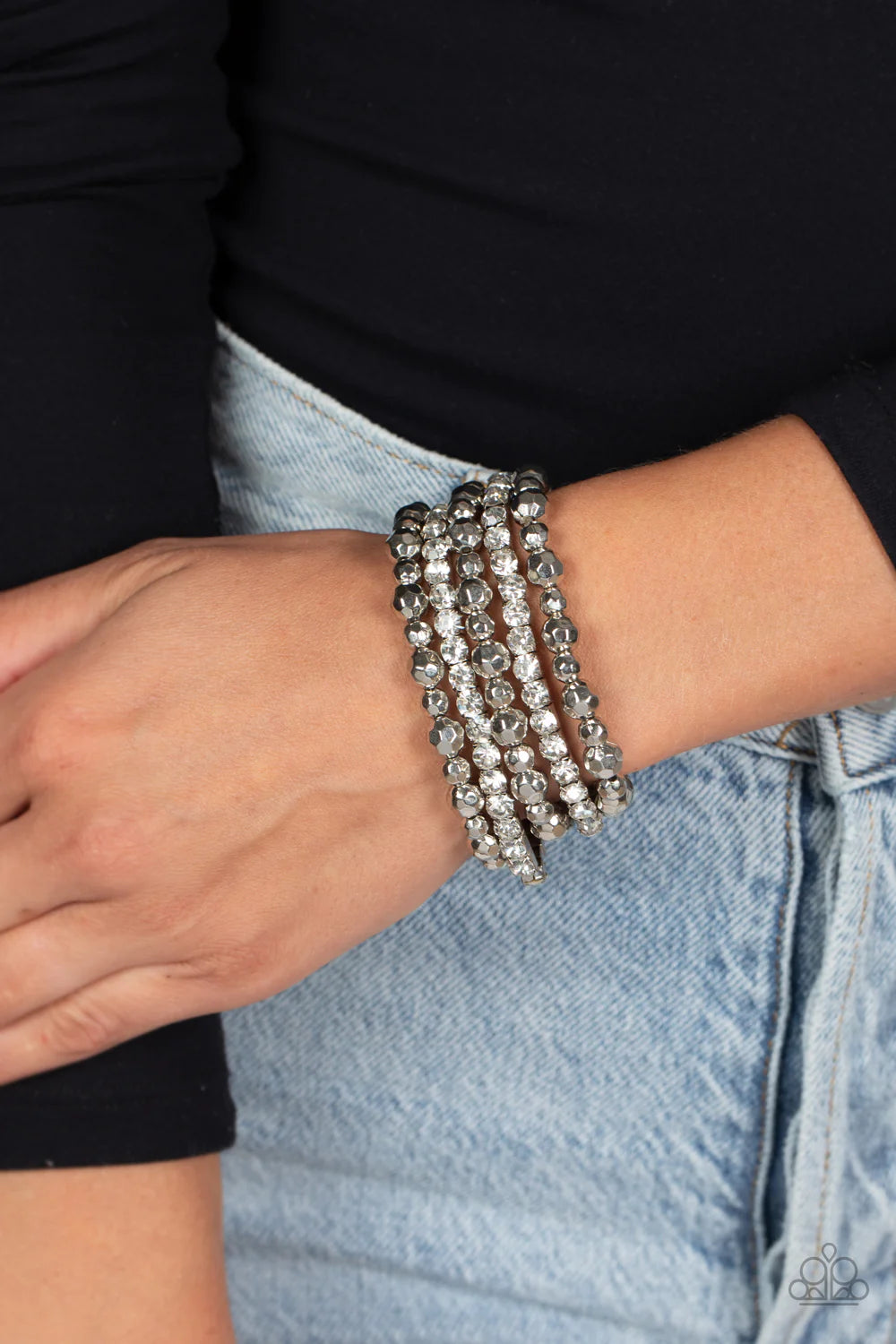 Paparazzi Accessories Top Notch Twinkle - White Threaded along elastic stretchy bands, varying sizes of faceted silver beads, combine with white gems pressed into silver square fittings for a glamorous, high-sheen stack around the wrist. Sold as one set o