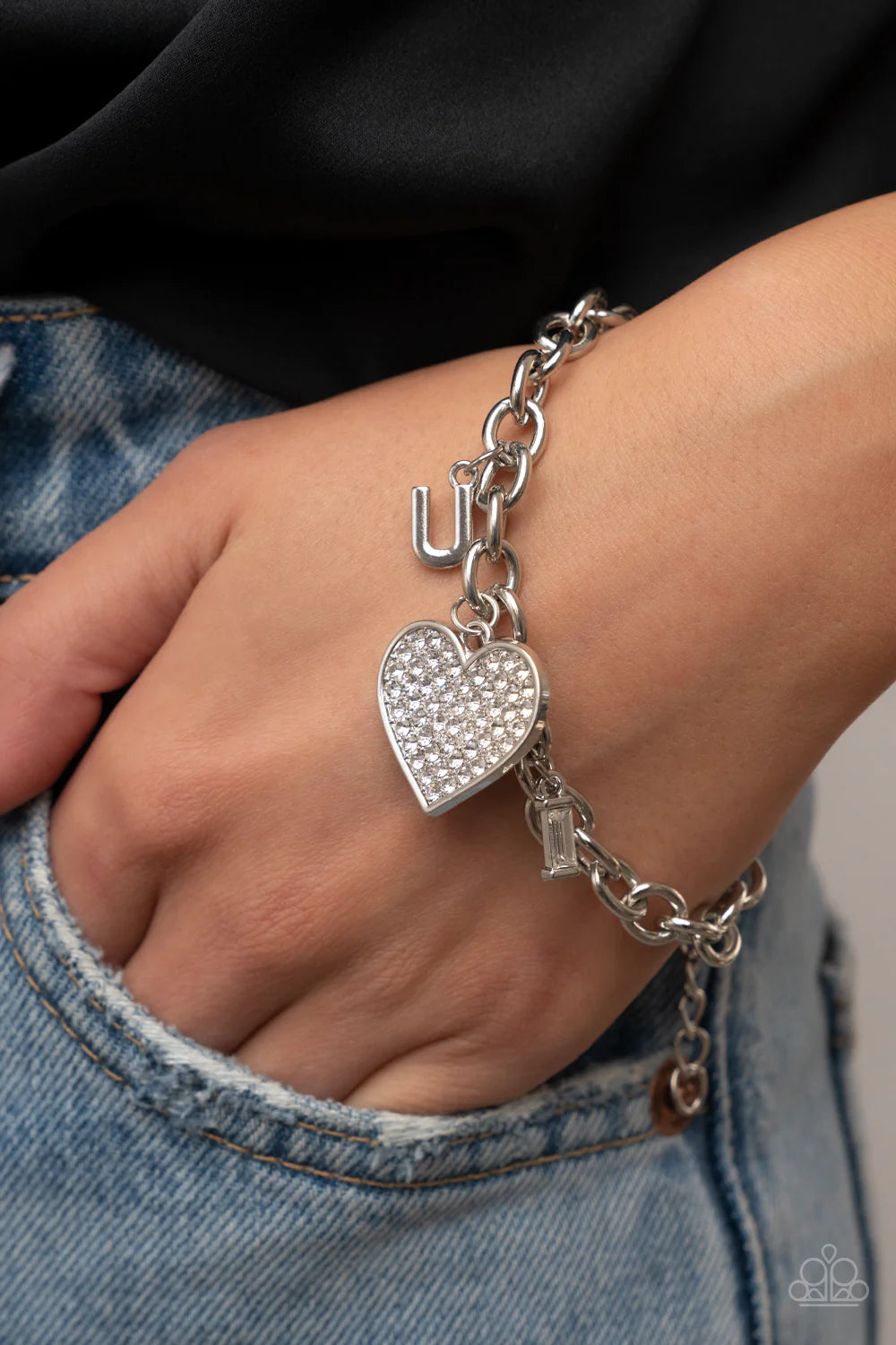 Paparazzi Accessories Declaration of Love - White Threaded along elastic stretchy bands, varying sizes of faceted silver beads, combine with white gems pressed into silver square fittings for a glamorous, high-sheen stack around the wrist. Sold as one set