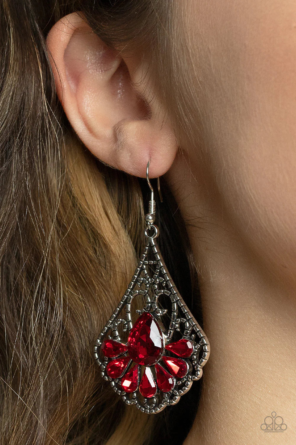 Paparazzi Accessories Exemplary Elegance - Red A sparkly collection of fiery red teardrop rhinestones fan out across the bottom of a textured filigree filled teardrop frame, creating an elegant centerpiece. Earring attaches to a standard fishhook fitting.