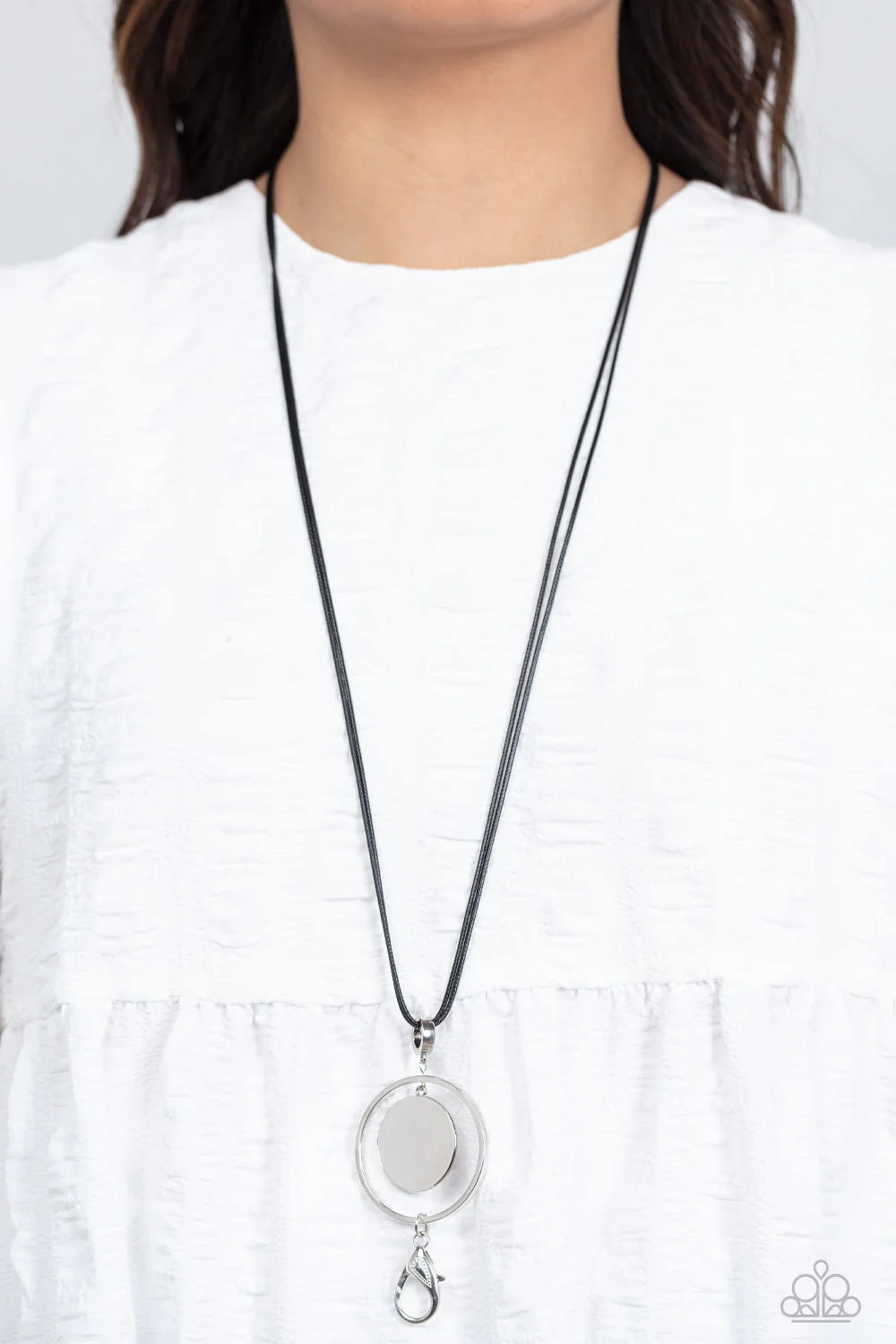 Paparazzi Accessories Rural Reflection - Black A silver disc swings from the top of an airy silver hoop, creating a shimmery pendant at the bottom of lengthened black cords for a colorful fashion. A lobster clasp hangs from the bottom of the design to all