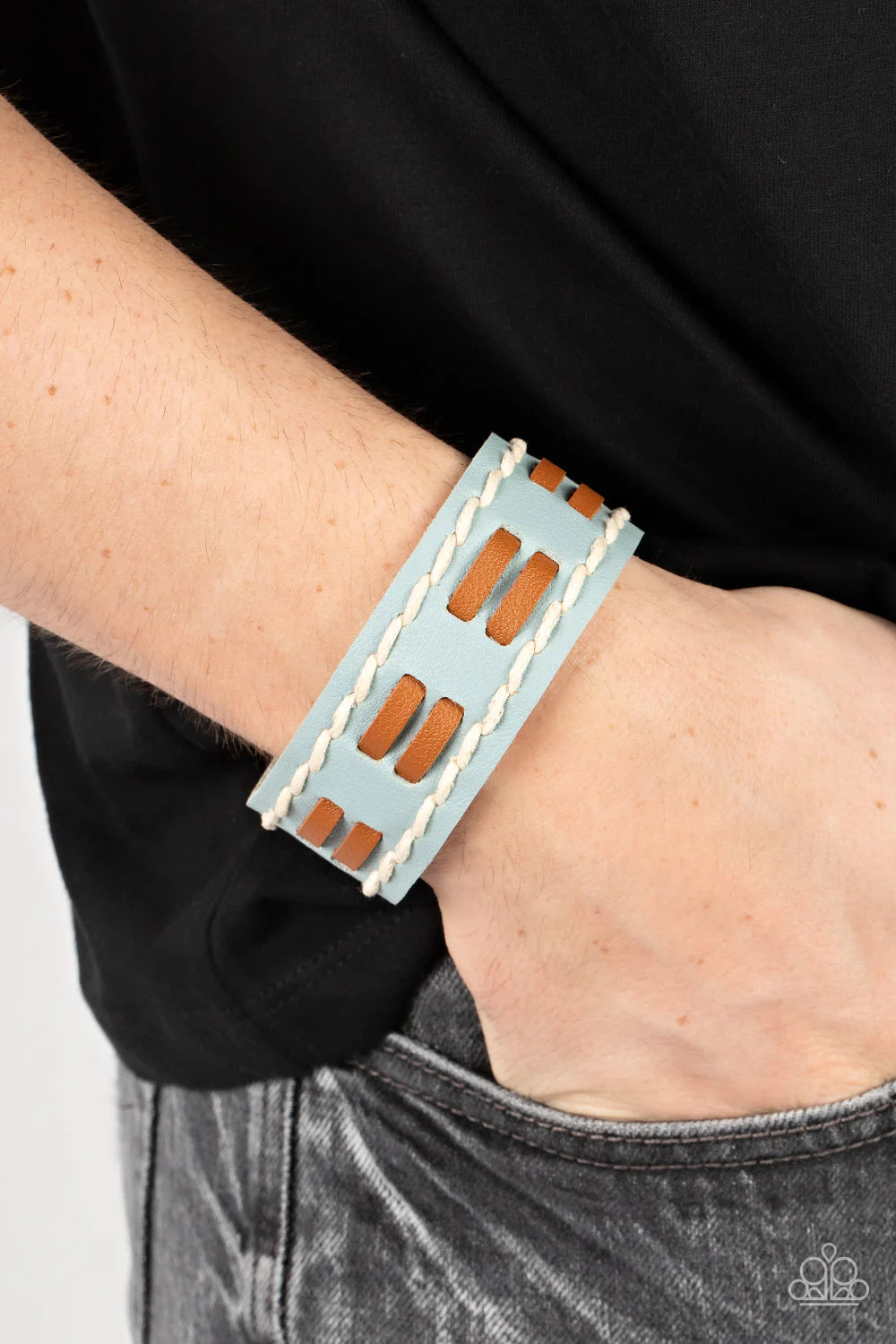 Paparazzi Accessories In the FRONTIER Running - Blue Flanked with white stitched rows, two rows of brown leather laces are threaded through the center of a blue leather band for a rustic pop of color around the wrist. Features an adjustable snap closure.