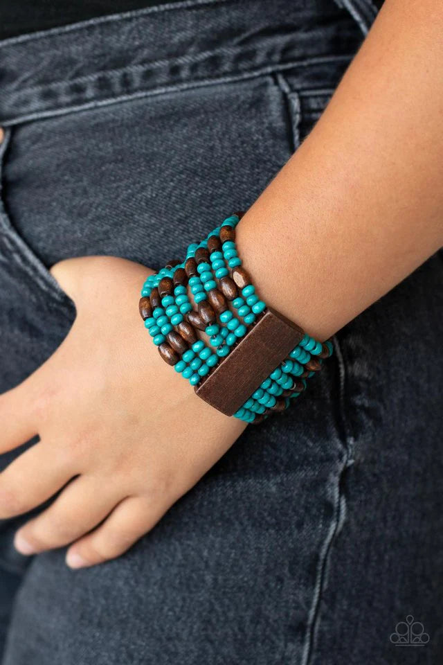 Paparazzi Accessories Tropical Nirvana - Blue Held together with brown wooden rectangular frames, mismatched rows of oval brown and round blue wooden beads are threaded along stretchy bands around the wrist for a whimsically layered look. Jewelry