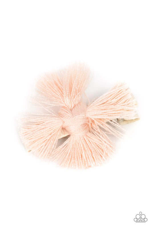 Paparazzi Accessories Tasseled Terrace - Pink An earthy fringe of pale pink tassels are knotted together to form a boho-chic style over a white ribbon clip. Features a standard hair clip on the back. Sold as one individual hair clip. Hair Accessories