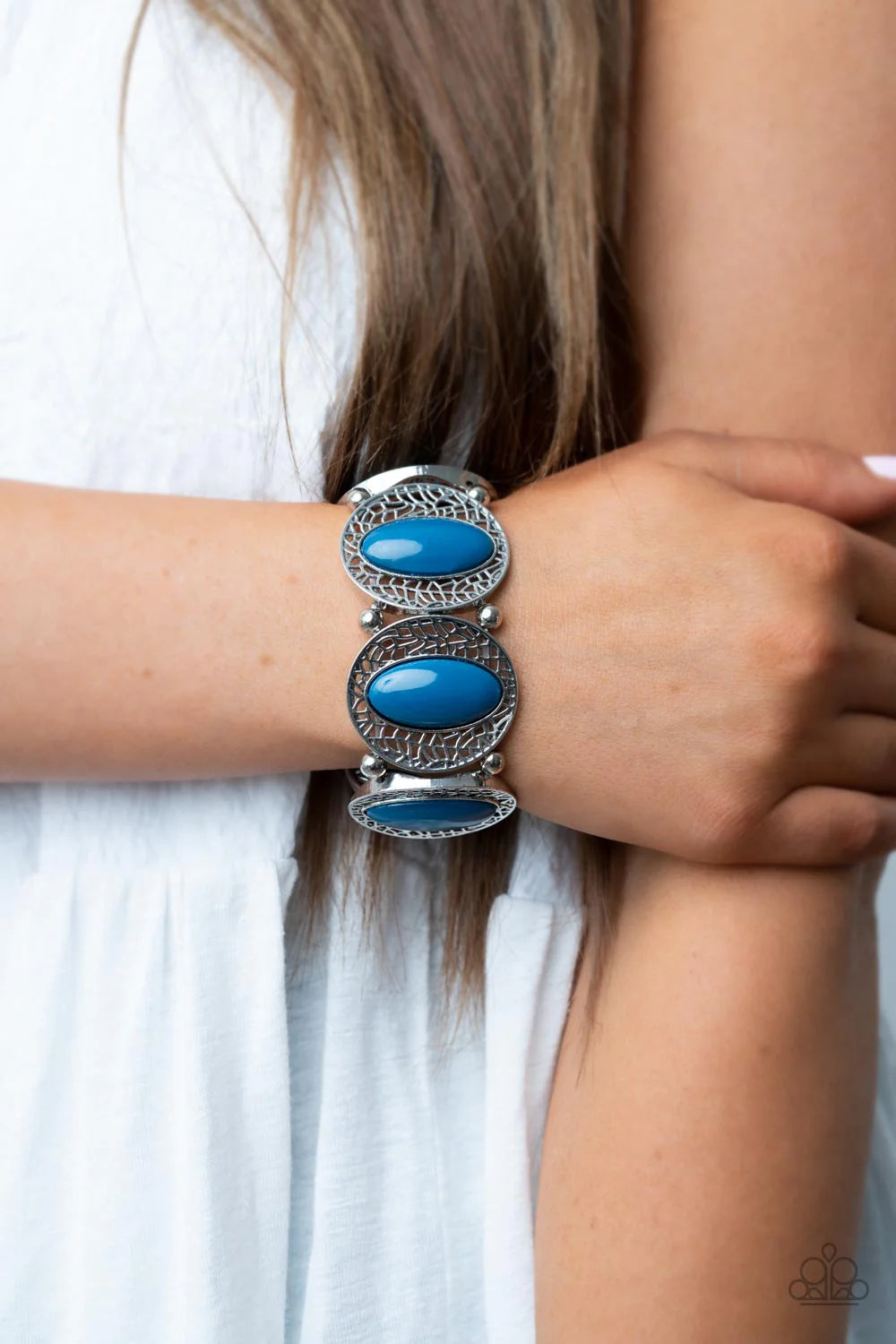 Paparazzi Accessories Eastern Escapade - Blue Bordered in airy stenciled frames, bubbly Mykonos Blue beaded silver frames join pairs of silver beads along stretchy bands along the wrist for a whimsical pop of color. Sold as one individual bracelet. Jewelr