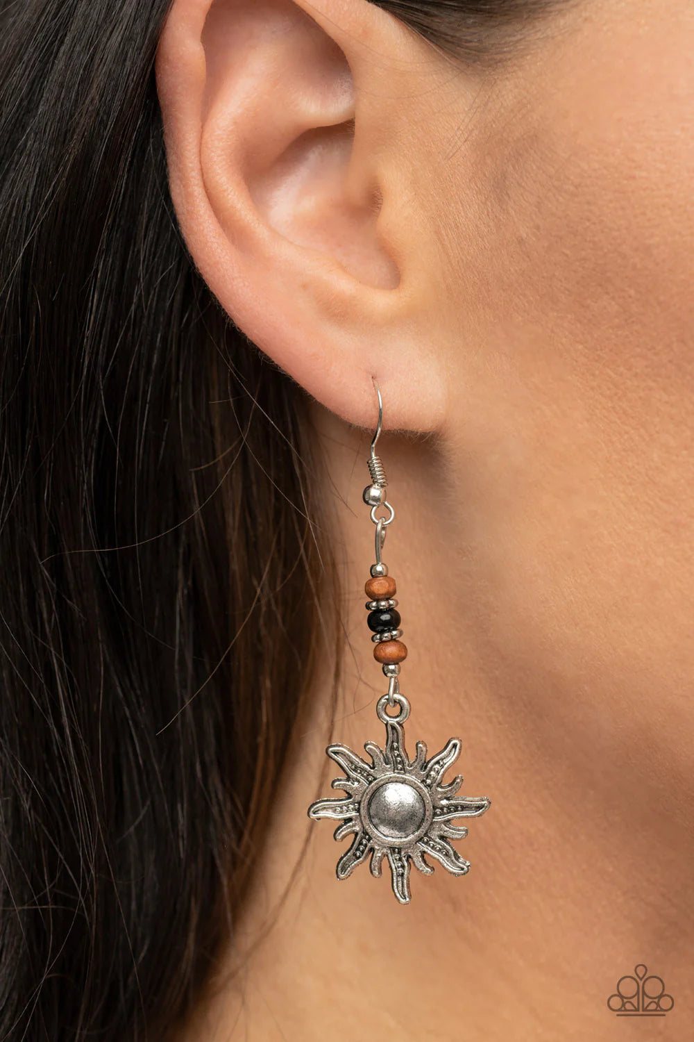 Paparazzi Accessories Sunshiny Days - Black Dainty silver rings, wooden beads, and a shiny black accent are threaded along a silver rod that attaches to a rustic silver sun charm, resulting in a groovy lure. Earring attaches to a standard fishhook fitting