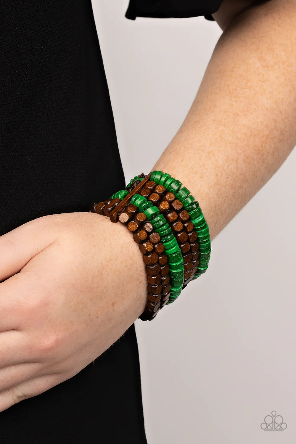 Paparazzi Accessories Fiji Fiesta - Green Stretchy strands of brown wooden cube beads and refreshing green wooden discs are held in place by rectangular wooden frames, resulting in an earthy centerpiece around the wrist. Sold as one individual bracelet. J