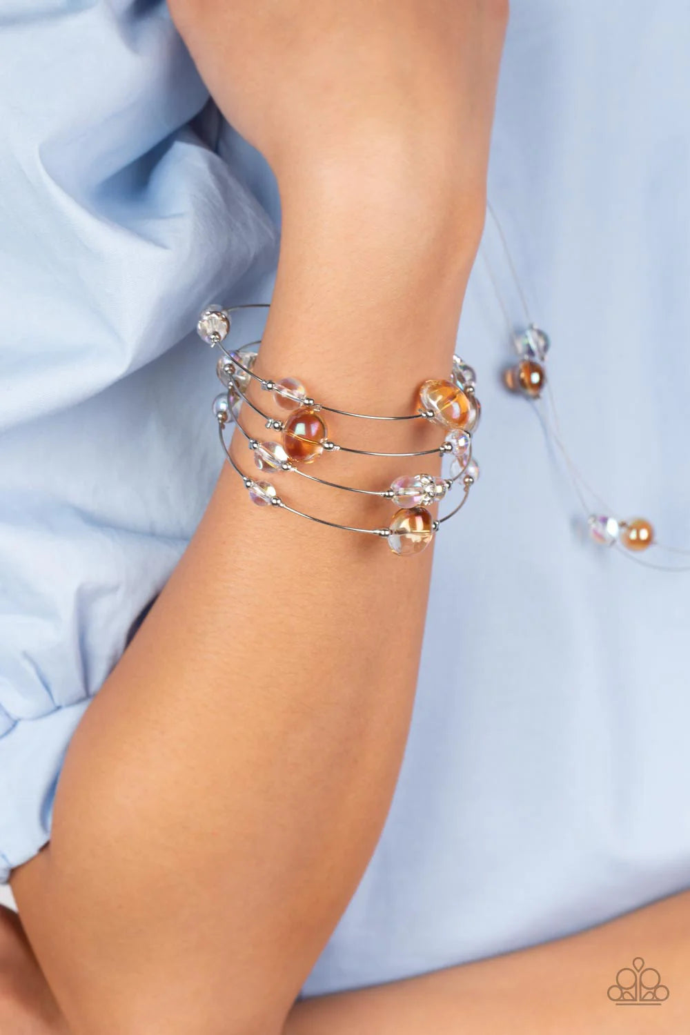 Paparazzi Accessories Optical Auras - Multi Glassy, orange and iridescent beads sporadically dot a strand of skinny wire, creating the illusion of floating spheres as they coil around the wrist in an infinity-wrap bracelet. One side of each marble-like be