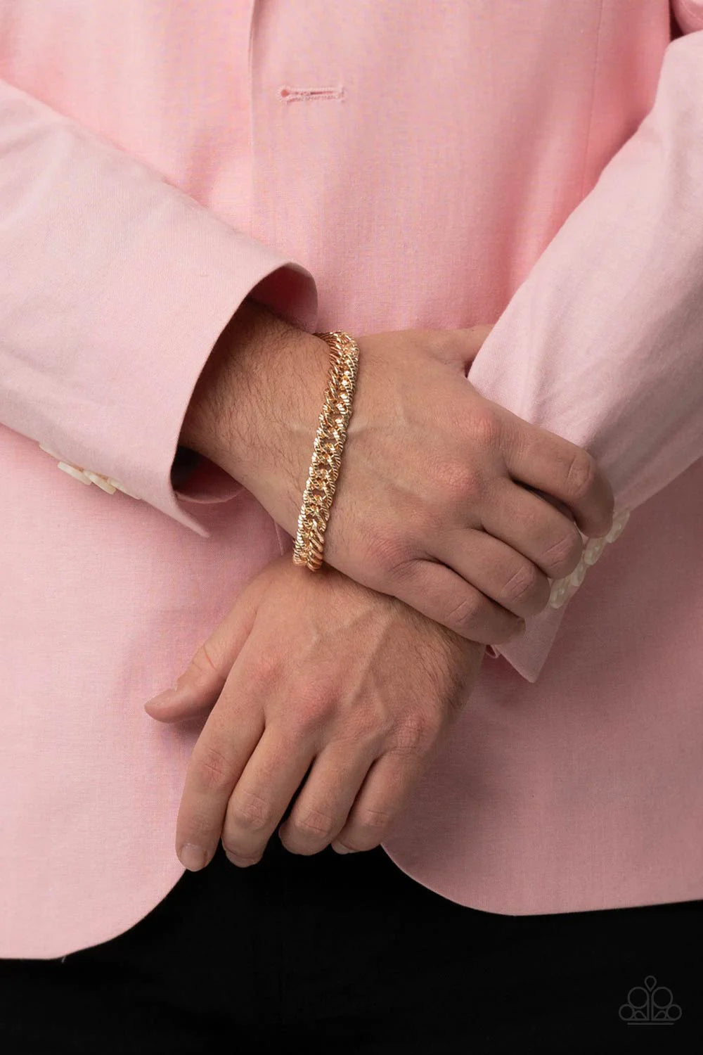 Paparazzi Accessories On The Up and UPPERCUT - Gold Etched in linear textures, an oversized gold chain drapes around the wrist for a dramatic industrial effect. Features an adjustable clasp closure. Sold as one individual bracelet.