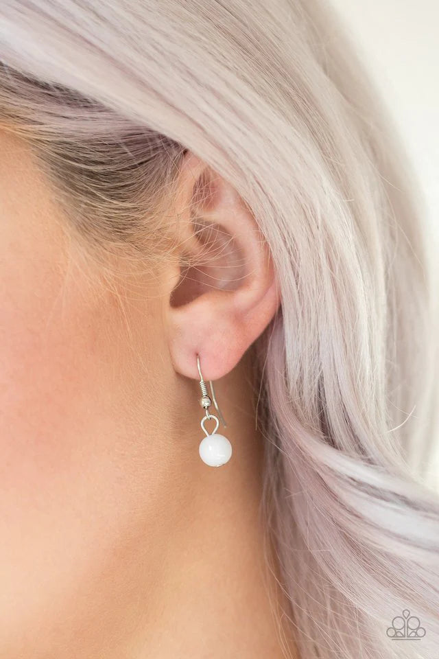 Paparazzi Accessories Color Boost - White Featuring glassy and polished finishes, dainty white beads join ornate silver frames along a shimmery silver chain for a whimsical look. Features an adjustable clasp closure. Sold as one individual necklace. Inclu