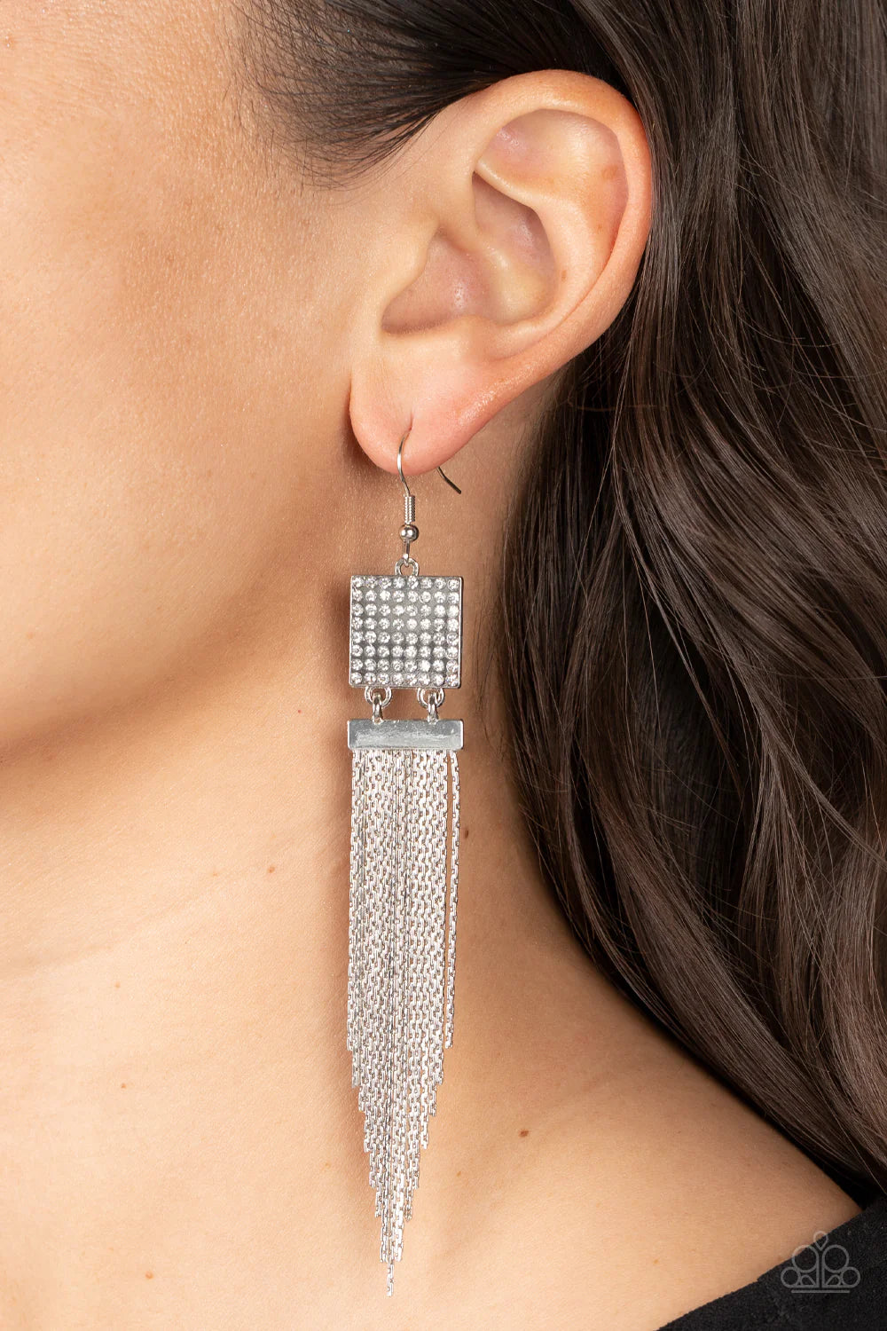 Paparazzi Accessories Dramatically Deco - White A tapered curtain of flat silver chains cascades from a silver rectangular fitting that delicately links to a silver square frame dotted in dainty white rhinestones, resulting in a trendy tassel. Earring att