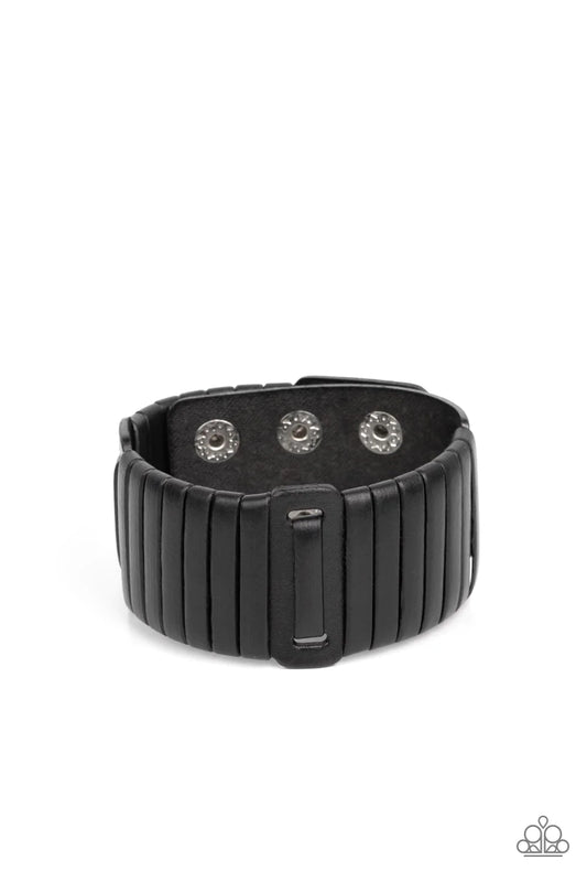 Paparazzi Accessories Leather Lumberyard - Black A black leather lace is wrapped around and through a thick black leather band, resulting in a rugged centerpiece around the wrist. Features an adjustable snap closure. Sold as one individual bracelet.