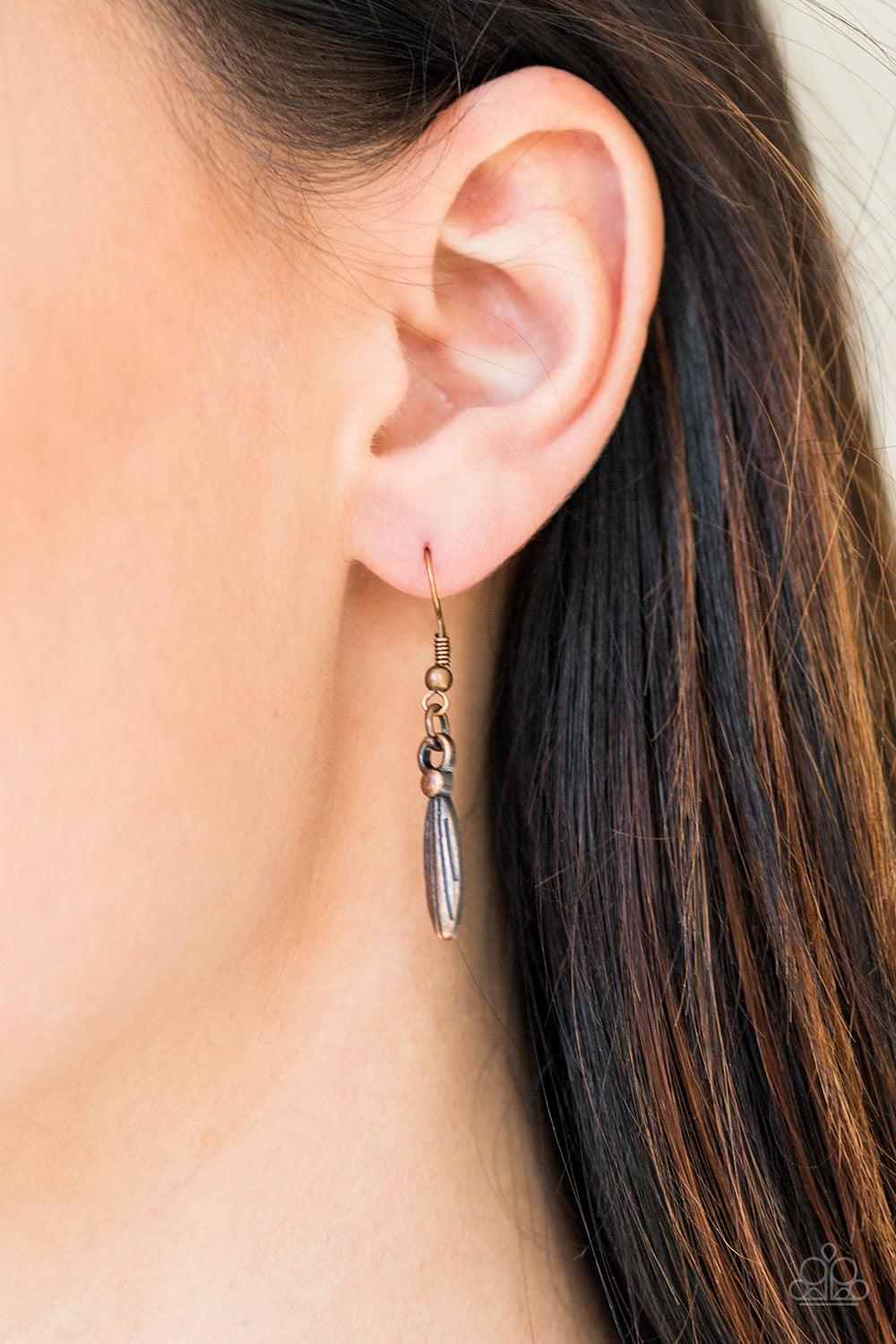 Paparazzi Accessories Eastern Empress - Copper Stamped and embossed in tribal inspired patterns, three copper plates connect down the chest, creating a fiercely stacked pendant. Attached to twisted copper rods, ornate copper beads swing from the bottom of