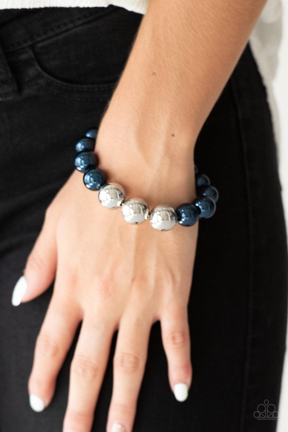 Paparazzi Accessories All Dressed UPTOWN - Blue Gradually increased in size near the center, oversized pearly blue and shiny silver beads are threaded along a stretchy band around the wrist for a glamorous finish. Sold as one individual bracelet. Jewelry