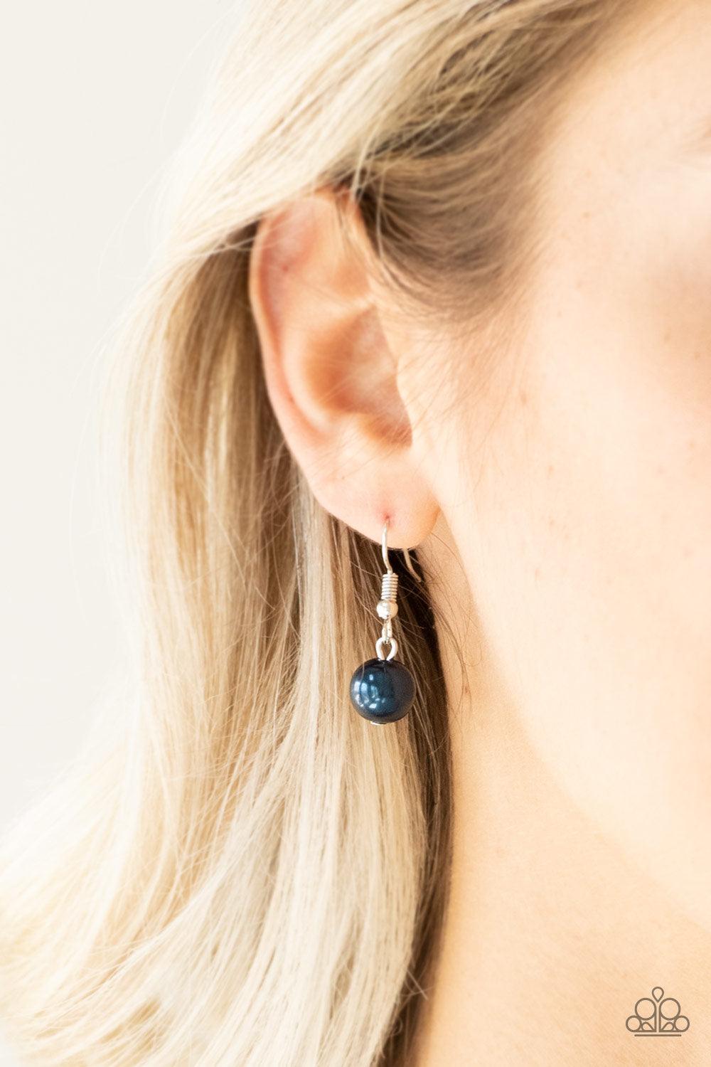 Paparazzi Accessories Uptown Talker - Blue Varying in size, pearly blue and oversized silver beads give way to sections of bold silver chain. Layers of silver chains drape across the bottom of the design for a flawless finish. Features an adjustable clasp