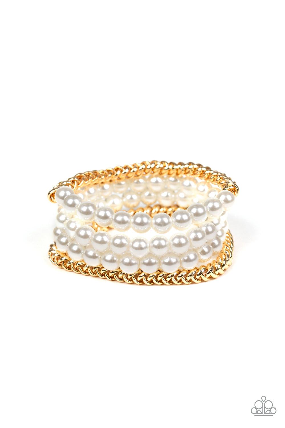 Paparazzi Accessories Industrial Incognito - Gold A collection of pearly white beads and glistening gold chains are threaded along stretchy bands, creating a bold collision of industrial glamour. Sold as one set of four bracelets. Jewelry