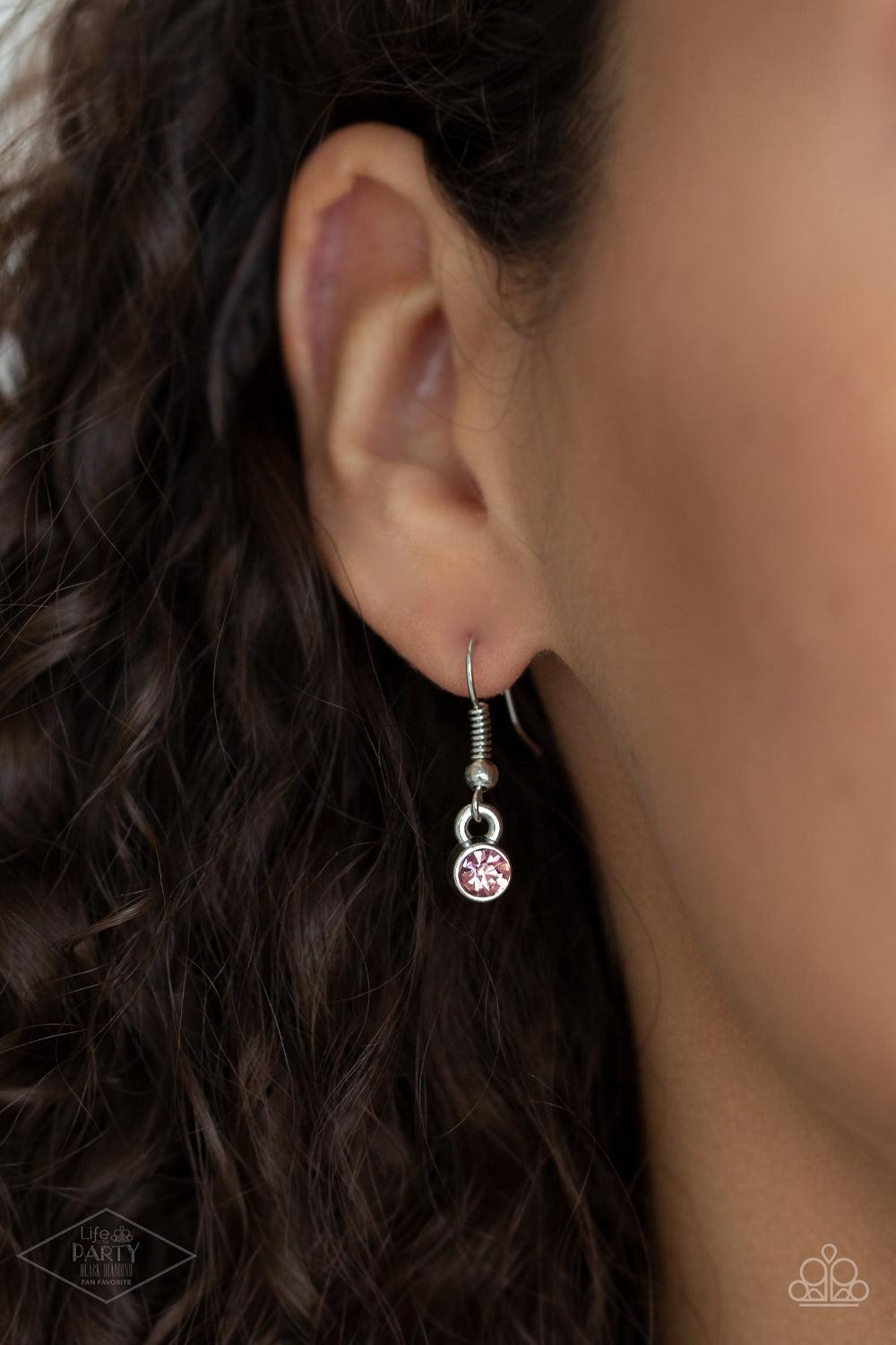 Paparazzi Accessories Flirtatiously Flashy - Pink Set atop a sleek silver fitting, a glittery pink heart-shaped gem swings from the bottom of a classic silver chain below the collar for a whimsical look. Features an adjustable clasp closure. Sold as one i