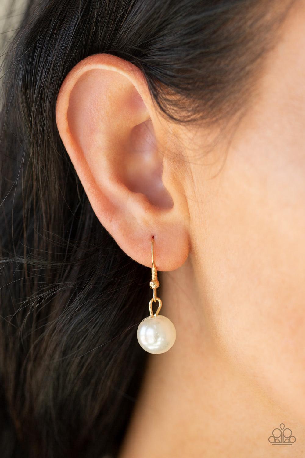 Paparazzi Accessories Social Hour - Gold A collection of bubbly white pearls link into two strands down the chest. A shimmery gold tassel swings from the lowermost strand, adding a timeless twist to the classic pearl palette. Features an adjustable clasp