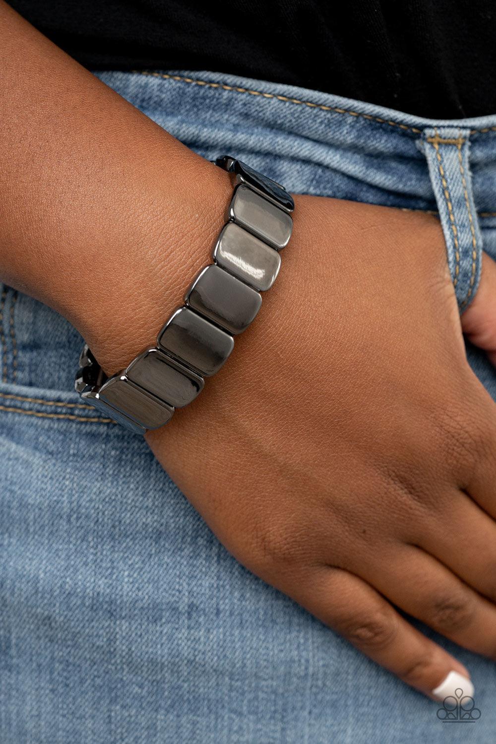 Paparazzi Accessories Retro Effect - Black Brushed in a glistening shimmer, shiny gunmetal rectangular frames are threaded along stretchy bands around the wrist for a sleek industrial look. Sold as one individual bracelet. Jewelry