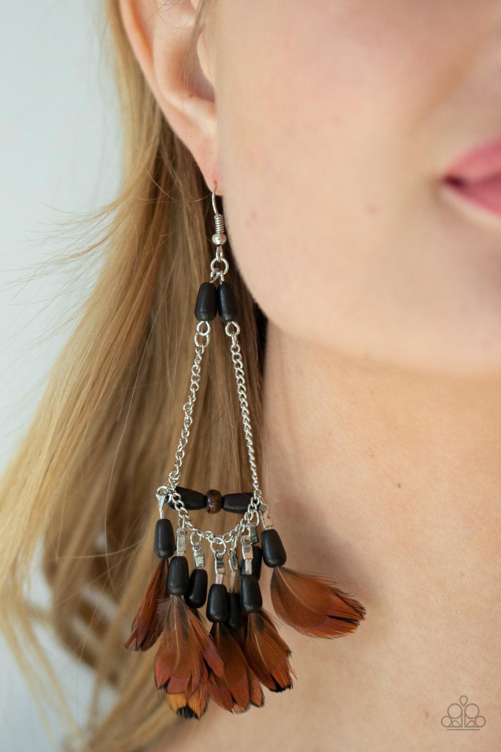 Paparazzi Accessories Haute Hawk - Black Infused with a wooden accent, an earthy assortment of black stone teardrop beads and dainty brown feathers create a free-spirited fringe at the bottom of a shimmery silver chain teardrop for a wildly wonderful fini