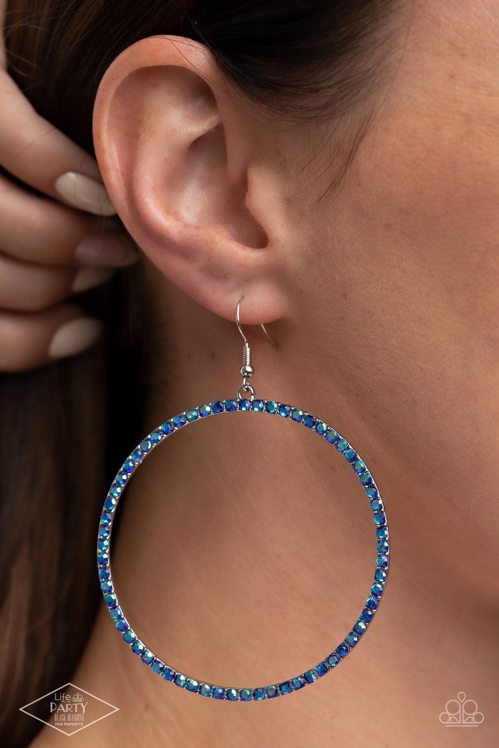 Paparazzi Accessories Wide Curves Ahead - Multi Encrusted in iridescent rhinestones, a dramatically oversized hoop swings from the ear for an exaggerated effect. Earring attaches to a standard fishhook fitting. Sold as one pair of earrings. Earrings