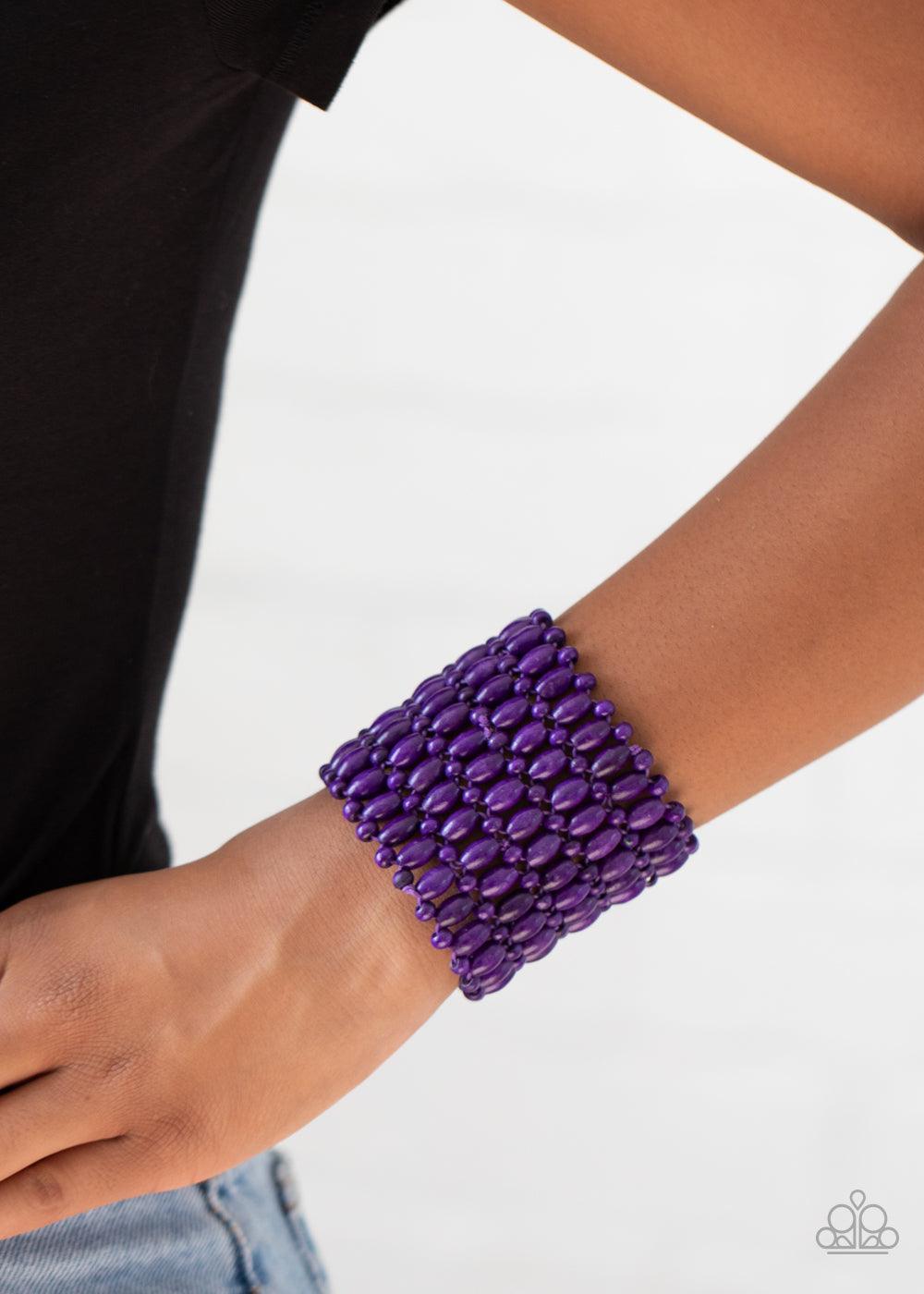 Paparazzi Accessories Way Down In Kokomo - Purple Round and oval purple wooden beads are threaded along stretchy bands that intricately weave around the wrist, coalescing into a colorful stretch bracelet. Sold as one individual bracelet. Jewelry