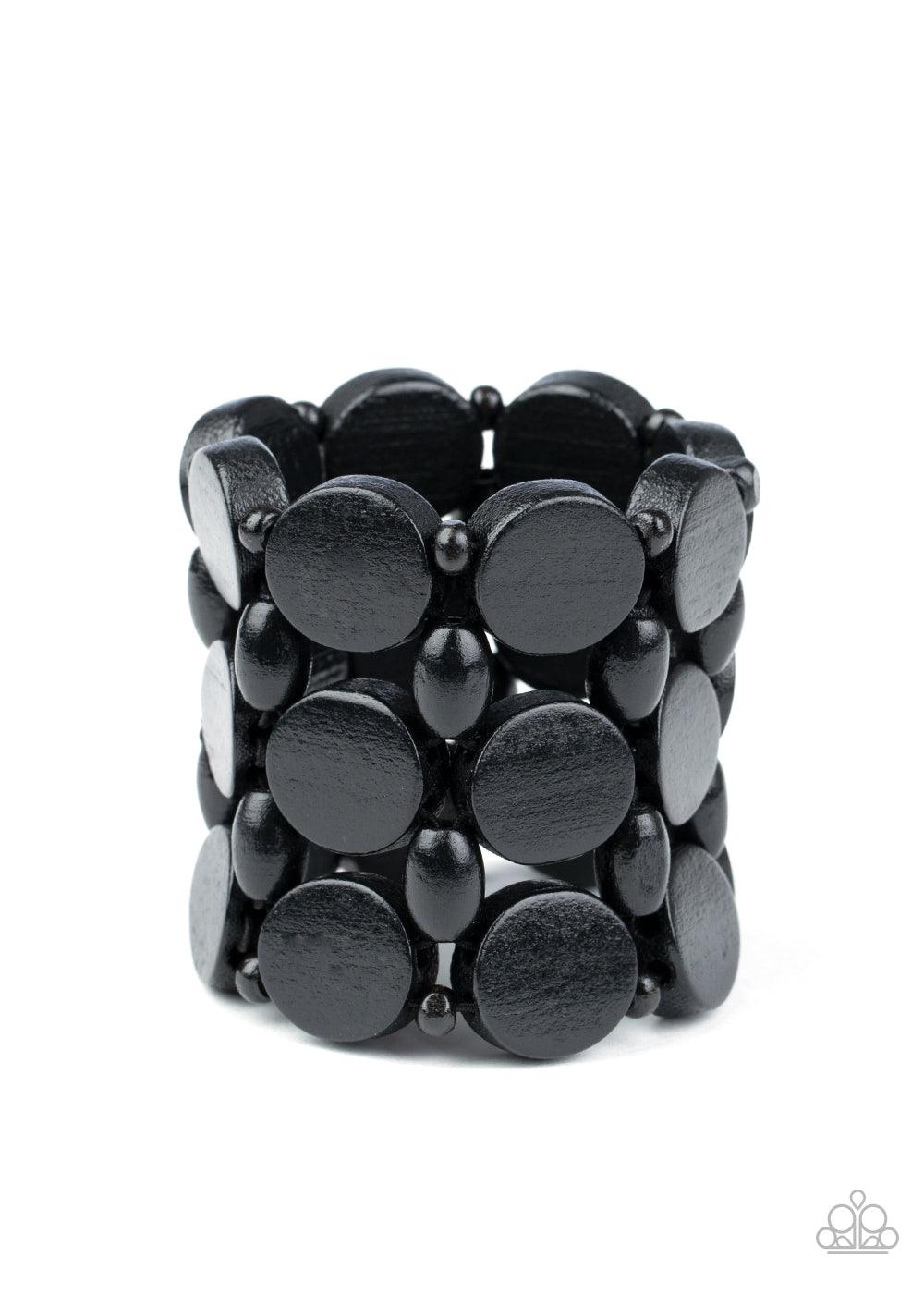 Paparazzi Accessories Cruising Coronado - Black Featuring disc, oval, and rounded shapes, a mismatched collection of shiny black wooden beads are threaded along knotted stretchy strands, creating a tropical inspired look around the wrist. Sold as one indi