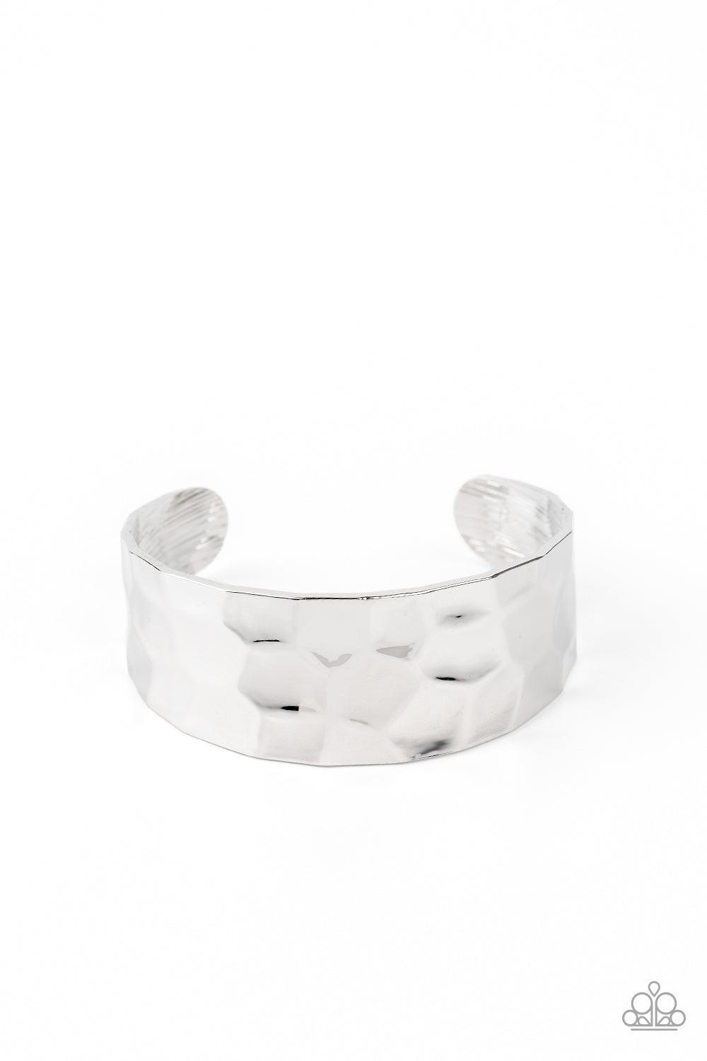 Paparazzi Accessories Is It HAUTE In Here? - Silver Hammered in edgy geometric detail, a shimmery silver cuff curls around the wrist for a bold pop of industrial inspiration. Sold as one individual bracelet. Jewelry
