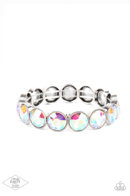 Paparazzi Accessories Number One Knockout - Multi 2 Faceted iridescent gems are pressed into sleek silver frames. The glittery frames are threaded along stretchy bands, creating a glamorous look around the wrist. Due to its prismatic palette, color may va