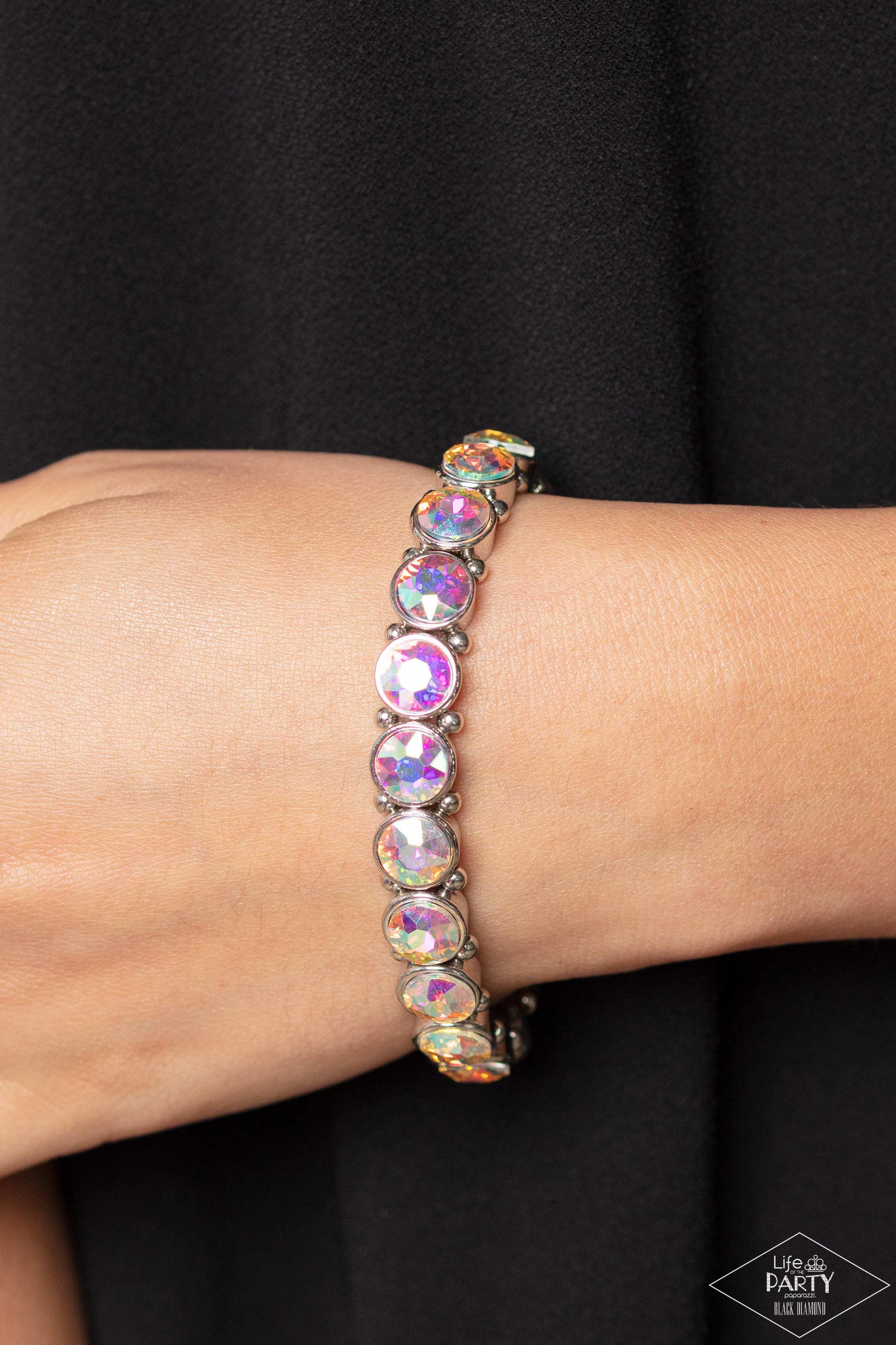 Paparazzi Accessories Sugar-Coated Sparkle - Multi Infused with dainty silver beads, glittery iridescent rhinestone-encrusted frames are threaded along stretchy bands around the wrist for a glamorous look. Sold as one individual bracelet. This Black Diamo