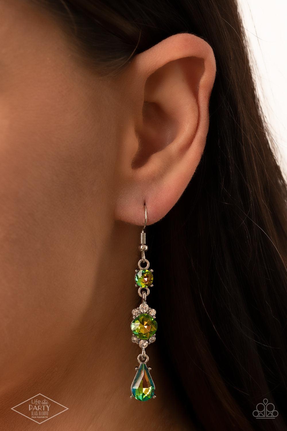 Paparazzi Accessories Outstanding Opulence - Multi Featuring a white rhinestone encrusted frame, an oversized oil spill rhinestone is linked between a classic round and teardrop oil spill rhinestone for an elegantly stacked look. Earring attaches to a sta