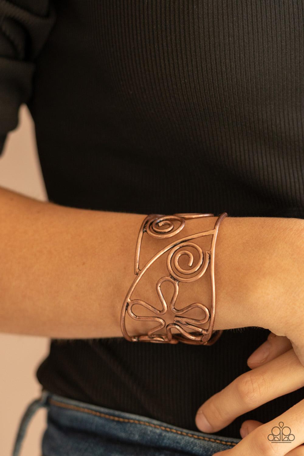 Paparazzi Accessories Groovy Sensations - Copper Antiqued copper wire bends and curls into groovy floral and swirl frames, coalescing into a psychedelic cuff around the wrist. Sold as one individual bracelet. Jewelry