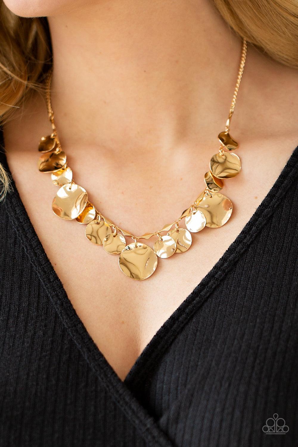 Paparazzi Accessories GLISTEN Closely - Gold Featuring diamond shaped gold fittings, a mismatched collection of hammered gold discs swings from a classic shiny gold chain below the collar for an eye-catching finish. Features an adjustable clasp closure. S