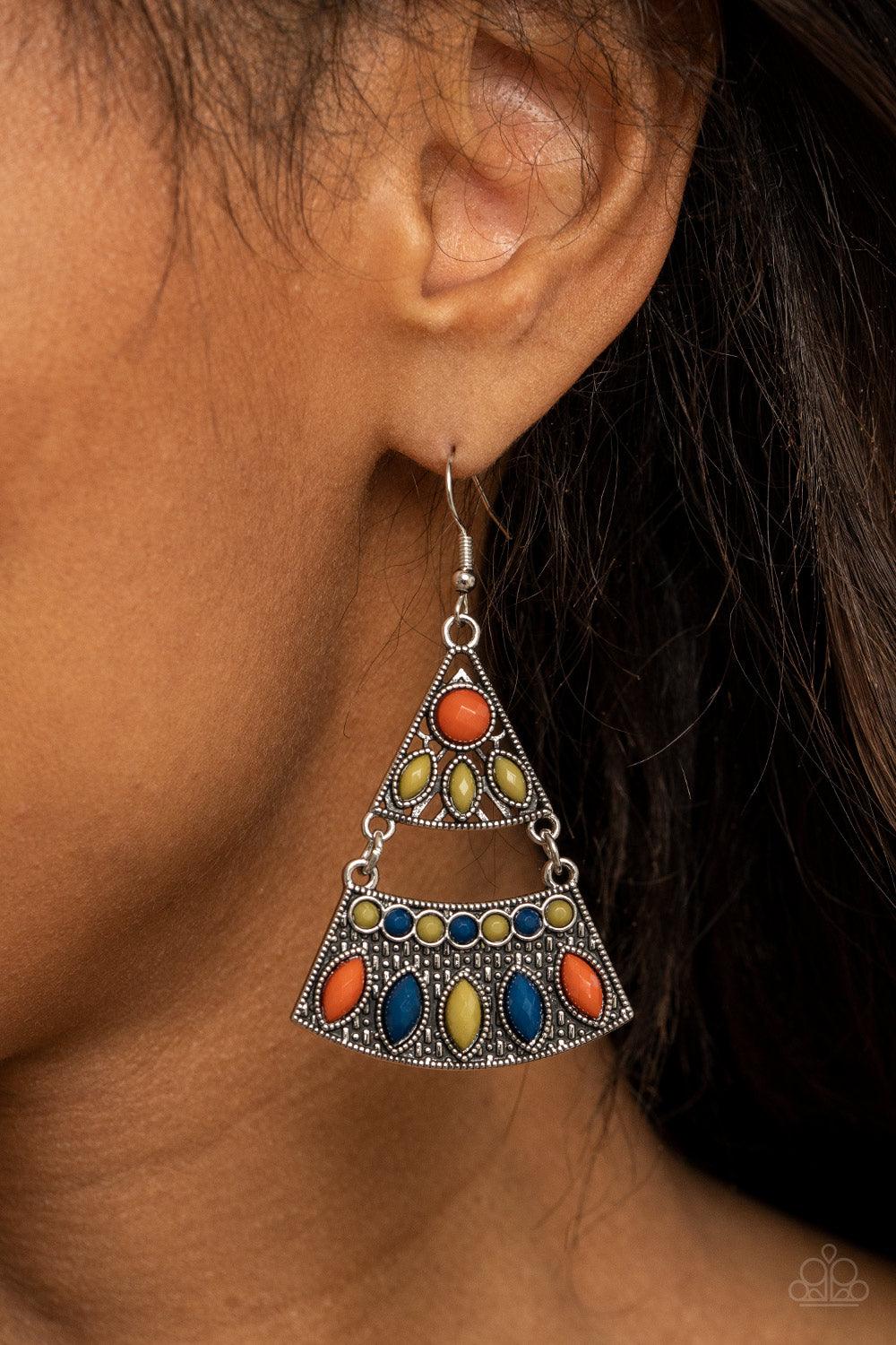 Paparazzi Accessories Desert Fiesta - Multi Mismatched blue, green, and Rust colored beads adorn the fronts of studded triangular and rectangular silver frames that link into a tribal inspired lure. Earring attaches to a standard fishhook fitting. Sold as