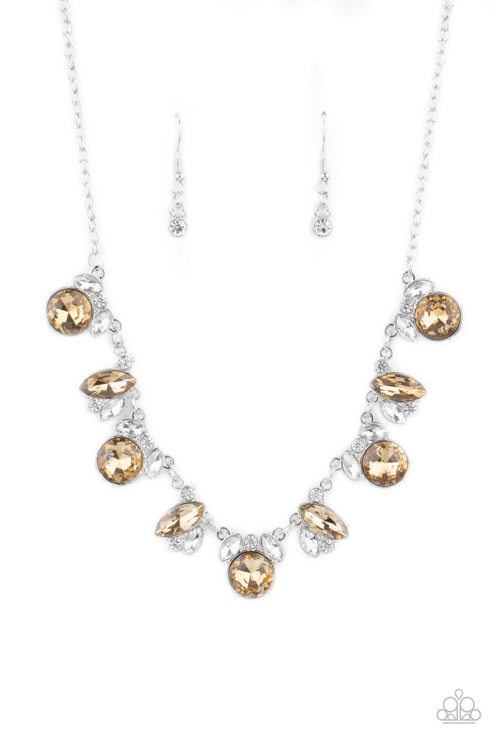 Paparazzi Accessories BLING to Attention - Brown A timeless array of round and marquise-cut white and golden topaz rhinestones delicately link into a collection of sparkly clusters, creating a scattered shimmer below the collar. Features an adjustable cla