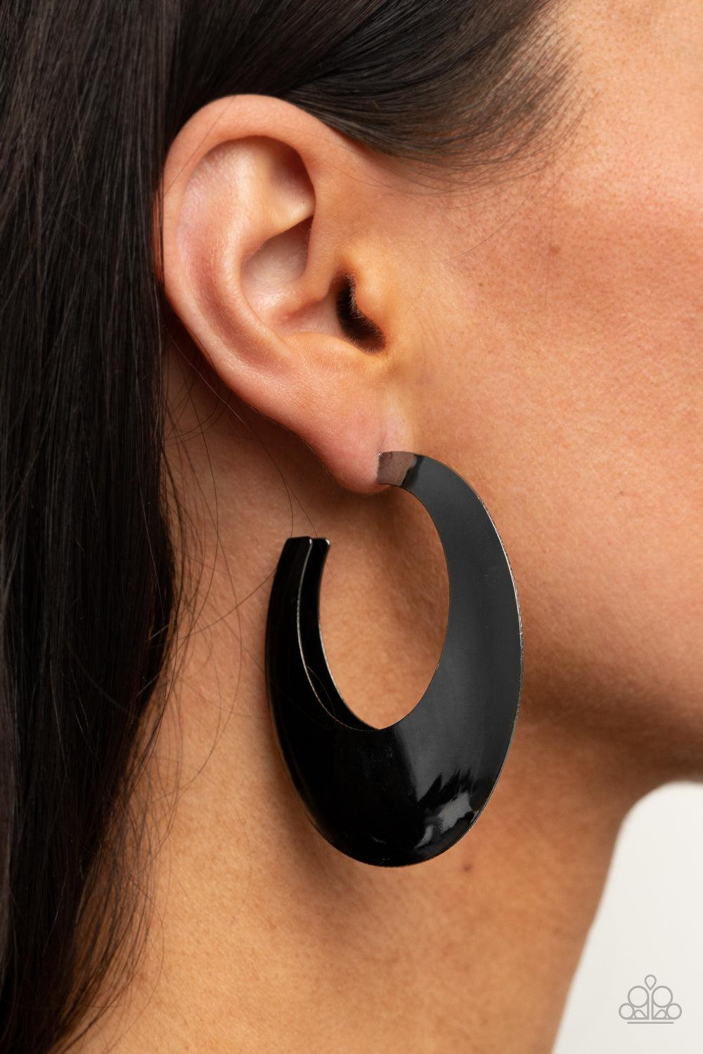 Paparazzi Accessories Going OVAL-board - Black Two gunmetal frames join into a beveled oval shaped hoop, creating a bold pop of metallic shimmer. Earring attaches to a standard post fitting. Hoop measures approximately 1 3/4" in diameter. Sold as one pair