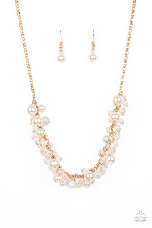 Paparazzi Accessories Pardon My FRINGE - Gold A royal collection of classic white pearls and glassy crystal-like beads swing from the bottom of a dainty gold chain, creating a glamorously clustered fringe below the collar. Features an adjustable clasp clo