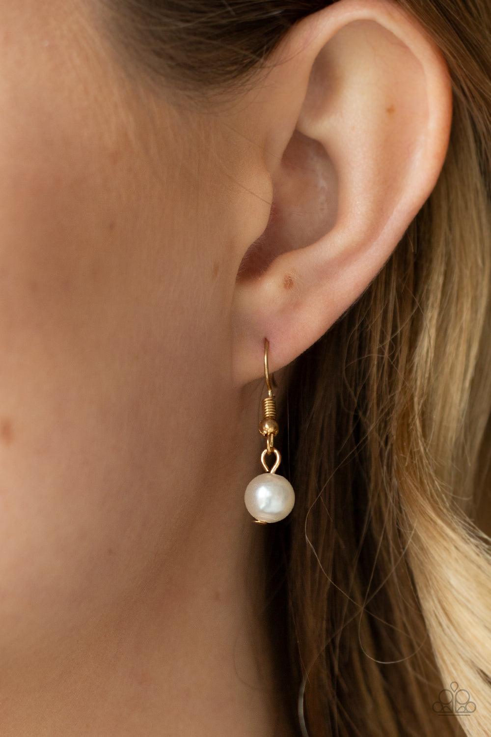 Paparazzi Accessories Pardon My FRINGE - Gold A royal collection of classic white pearls and glassy crystal-like beads swing from the bottom of a dainty gold chain, creating a glamorously clustered fringe below the collar. Features an adjustable clasp clo