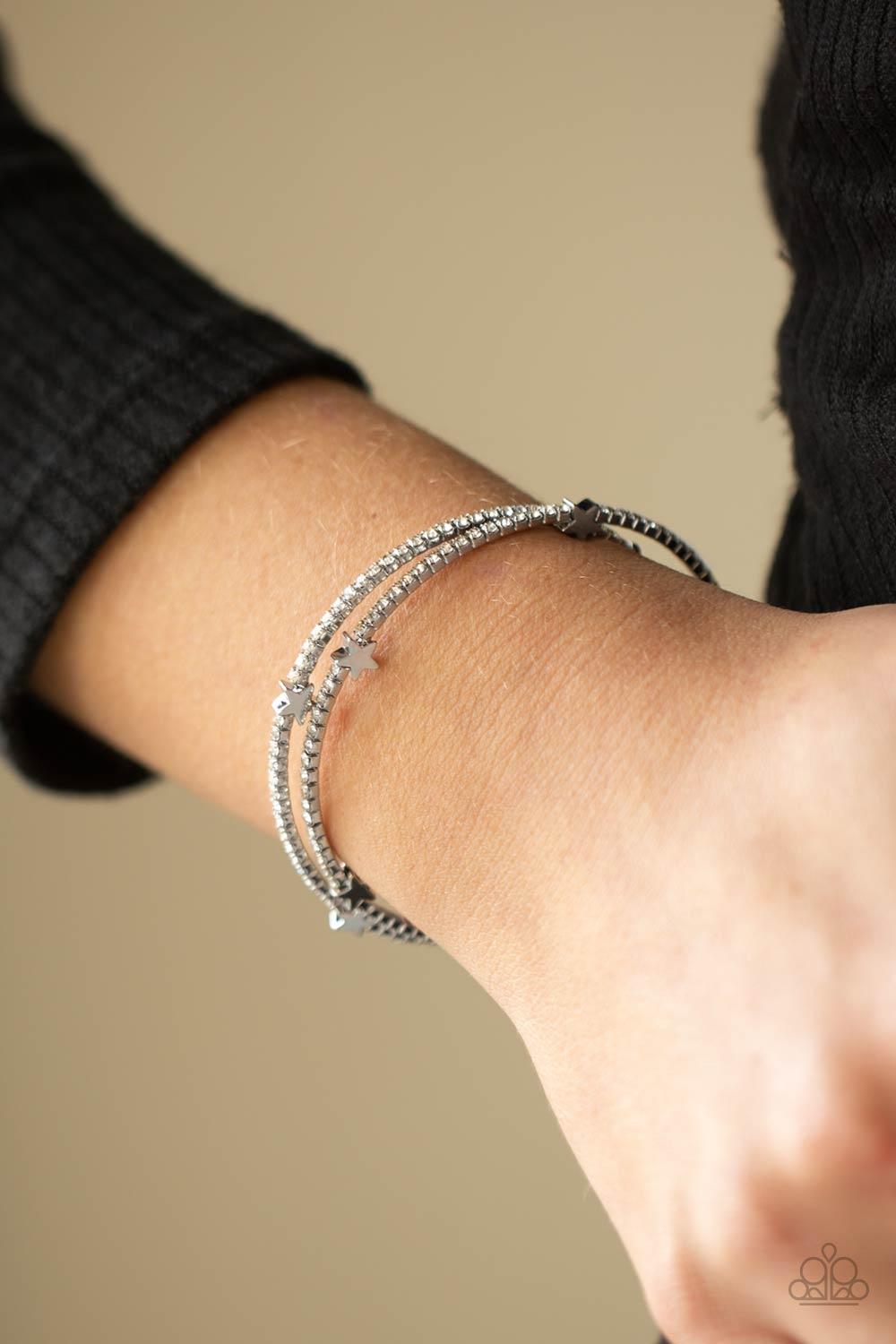 Paparazzi Accessories Let Freedom BLING - White Dotted with dainty silver star charms, a bendable row of glittery white rhinestones spirals around the wrist, creating a sparkly infinity wrap bracelet. Sold as one individual bracelet. Jewelry