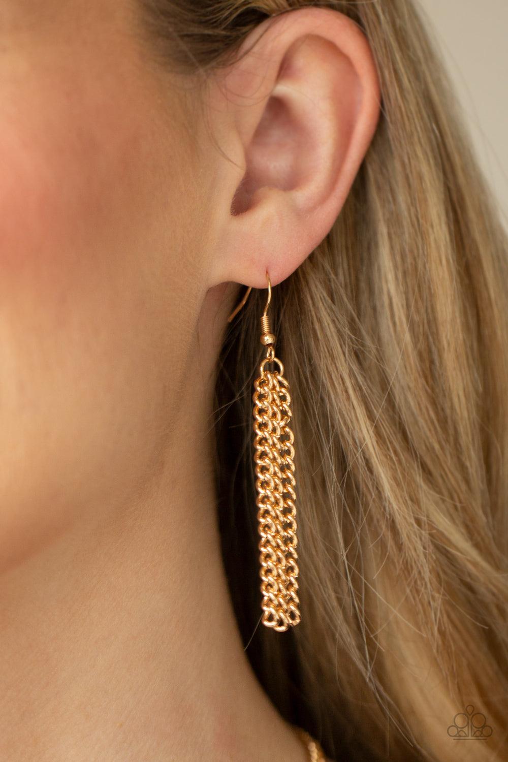 Paparazzi Accessories Metro Mirage - Gold A shiny collection of gold V-shape frames delicately overlap below the collar, creating an edgy optical illusion. Features an adjustable clasp closure. Sold as one individual necklace. Includes one pair of matchin