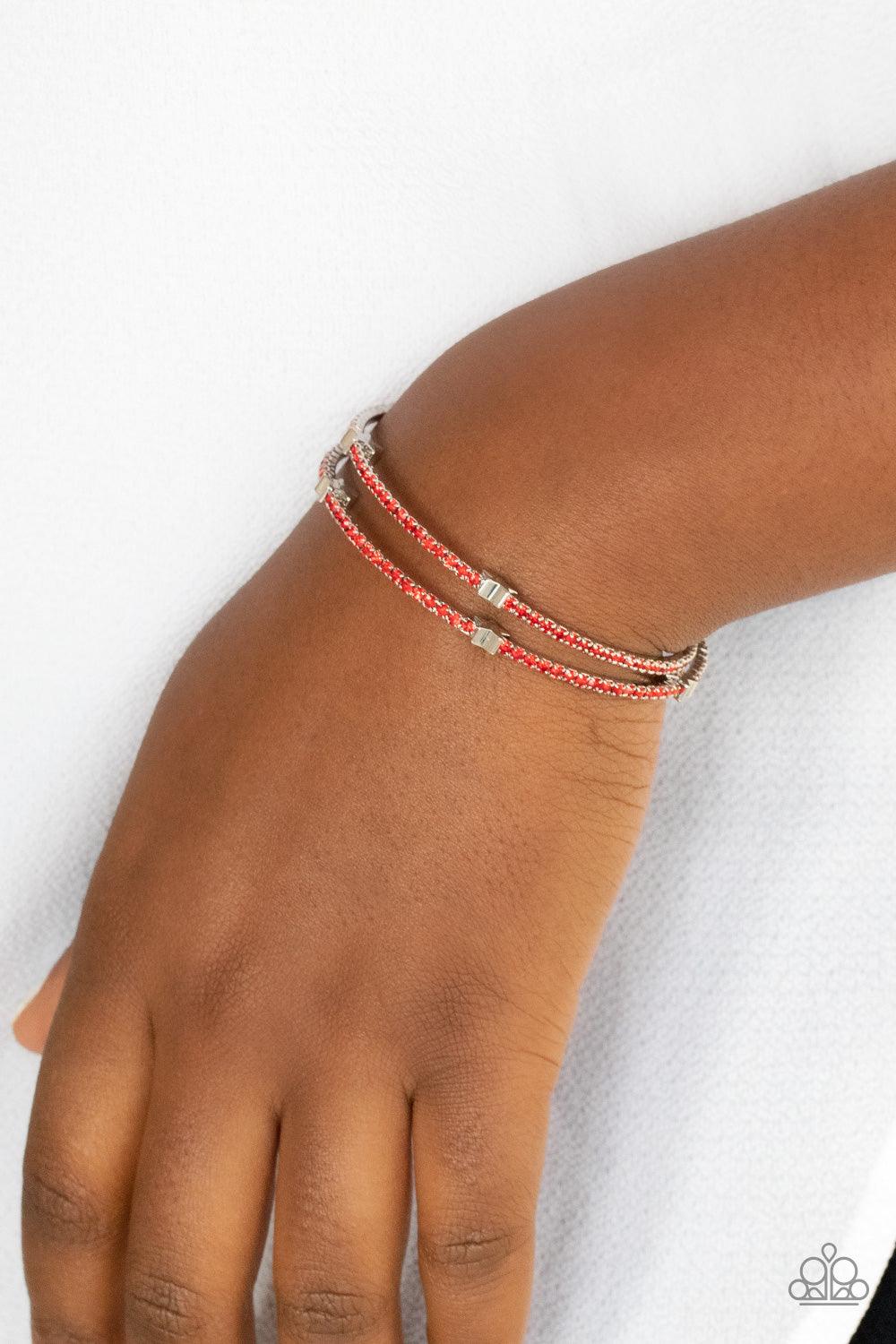 Paparazzi Accessories Let Freedom BLING - Red Dotted with dainty silver star charms, a bendable row of fiery red rhinestones spirals around the wrist, creating a sparkly infinity wrap bracelet. Sold as one individual bracelet. Bracelets