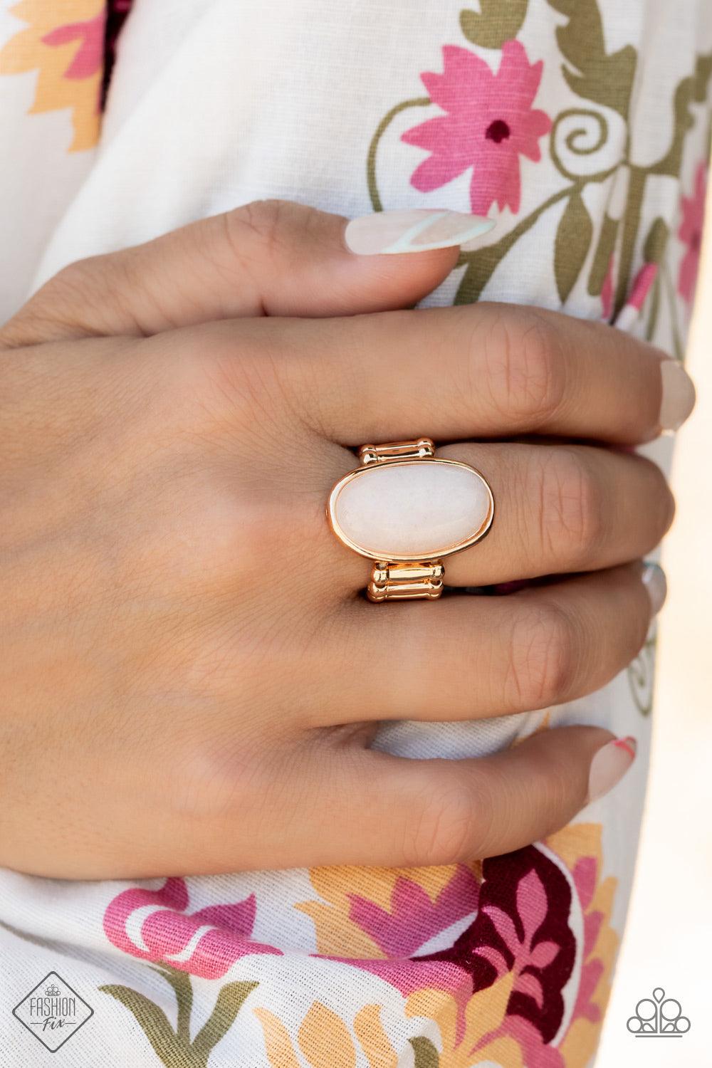 Paparazzi Accessories Mystical Mantra - Gold A white oval stone is encased inside a sleek gold frame, creating a mystical centerpiece atop the finger. Features a stretchy band for a flexible fit. Sold as one individual ring. Jewelry