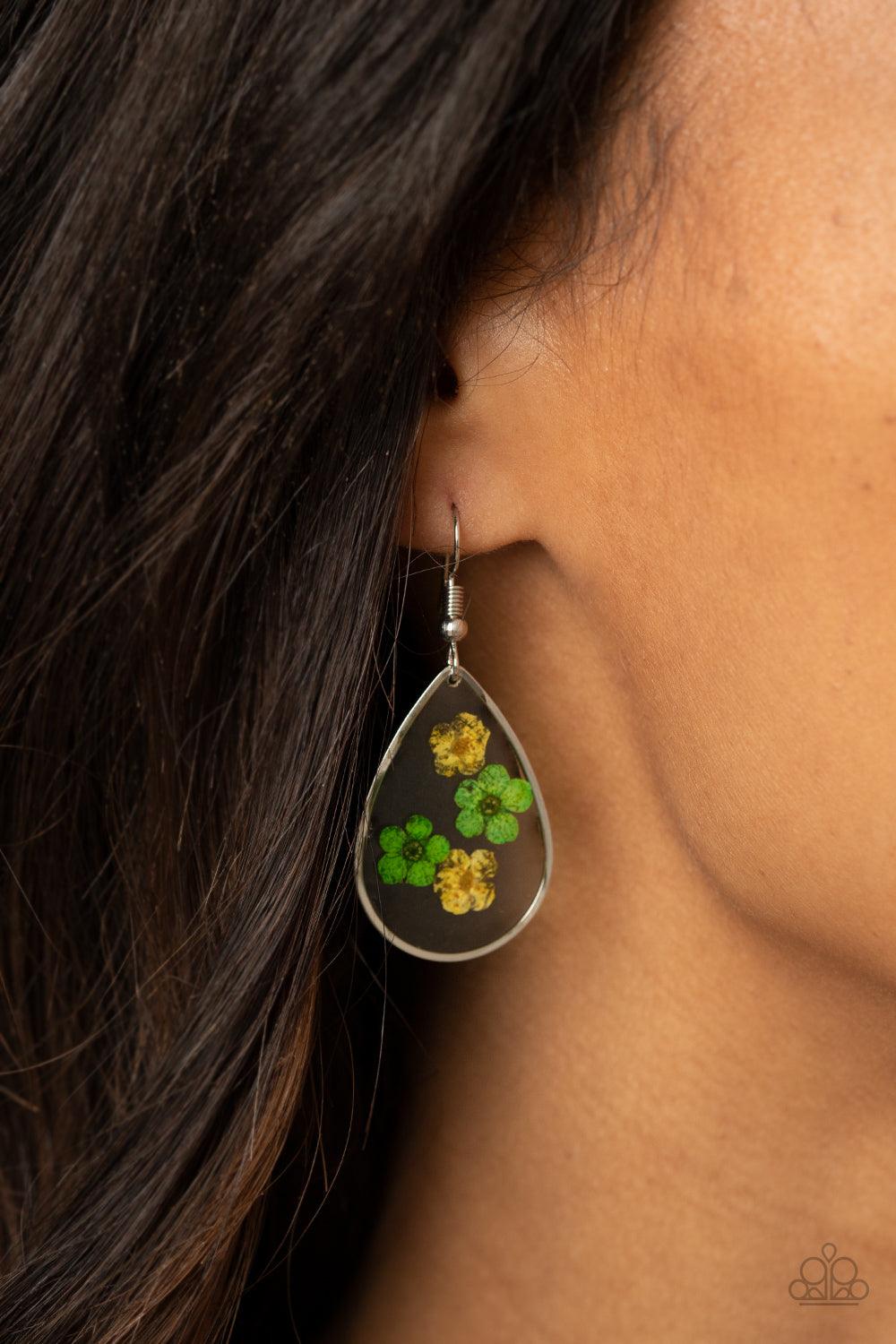 Paparazzi Accessories Perennial Prairie - Yellow Dainty yellow and green flowers are encased in a glassy teardrop, creating a whimsical frame. Earring attaches to a standard fishhook fitting. Sold as one pair of earrings. Jewelry