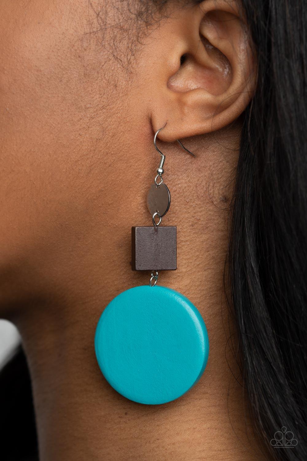 Paparazzi Accessories Modern Materials - Blue A shiny silver disc, brown wooden square, and oversized blue wooden circle delicately link into a colorfully retro lure for a trendsetting finish. Earring attaches to a standard fishhook fitting. Sold as one p